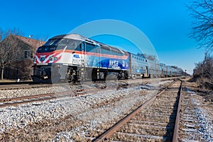 Metra locomotive pulls commuter train