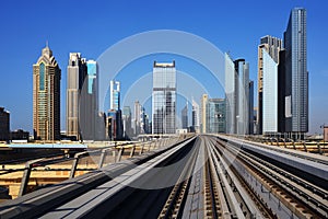 Metro on the background of skyscrapers of Dubai World Trade cent