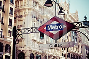 Metro Sign on blurred city, Madrid