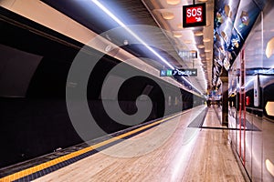 Metro station platform in Naples, Italy. The quay is empty.