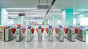 metro station ticket barriers with green light for entry