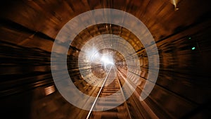 Metro subway tunnel with motion blur, view inside locomotive