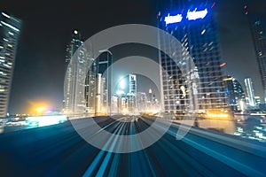 Metro track with skyline at night Dubai - UAE