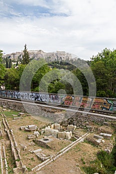 Metro train-line through Athens Ancient Agora with Acropolis in