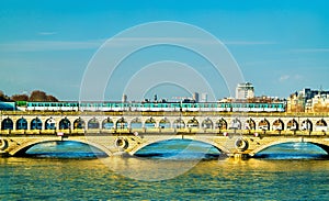 Metro train on the Pont de Bercy, a bridge over the Seine in Paris, France