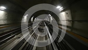 Metro in Turin , Italy. POV Train riding in the subway tunnel.