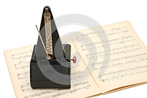 Metronome on sheet music photo
