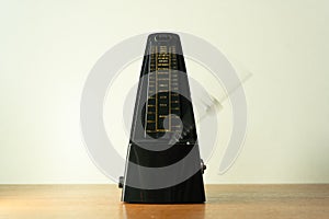 Metronome with swinging pendulum shot with motion blur effect