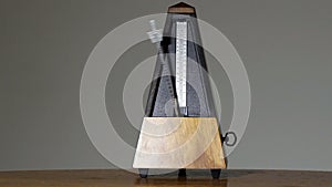 Metronome On Table Gray Background Largo Tempo