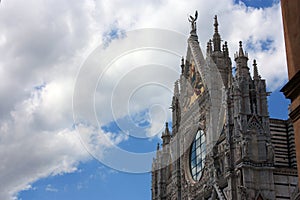 The Metropolitan Cathedral of Santa Maria Assunta or also the Duomo of Siena on a beautiful sunny day