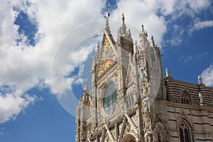 The Metropolitan Cathedral of Santa Maria Assunta or also the Duomo of Siena on a beautiful sunny day