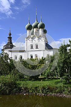 Metropolitan Garden with pond and apple trees and the Church of St. Gregory the Theologian of the 17th century in the Kremlin in