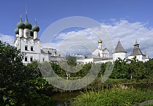 Metropolitan Garden with pond and apple trees and the Church of St. Gregory the Theologian of the 17th century in the Kremlin in
