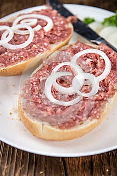 Mett on a bun (German cuisine; selective focus)
