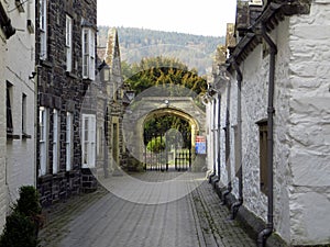 Mews cottages leading to a churchyard.