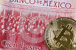 Mexican 100 peso bank note with a gold bitcoin