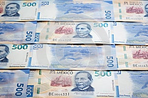 Mexican 500 pesos pile of blue bucks stack on top center