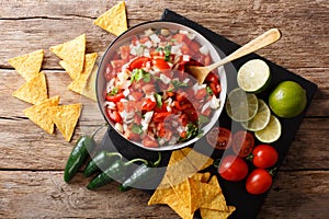 Mexican appetizer Pico de Gallo close-up in a bowl. Horizontal t