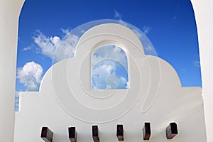 Mexican architecture white archs blue sky