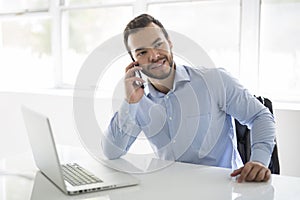 Mexican attractive businessman on his 30s working at modern home office with computer laptop