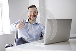 Mexican attractive businessman on his 30s working at modern home office with computer laptop