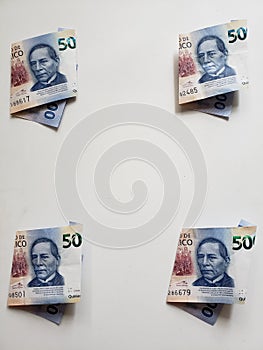 mexican banknotes of 500 pesos in corners and white background photo