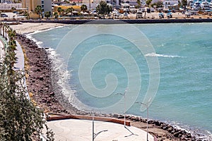 Mexican beach landscape, Mirador del Ruso and boardwalk with palm trees, Marina Atalanta in background photo