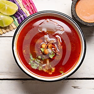 Mexican beef  birria consomme on white background