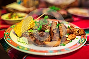 Mexican beef steak with corn and potato wedges