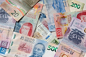 Mexican bills stacked front view in different denominations photo