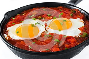 Mexican breakfast: Huevos rancheros in iron frying pan