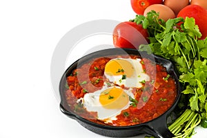 Mexican breakfast: Huevos rancheros in iron frying pan