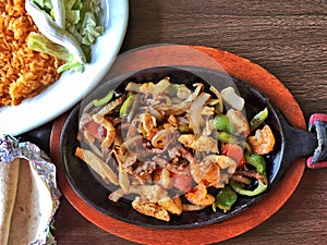 Mexican chicken fajitas on a hot plate photo