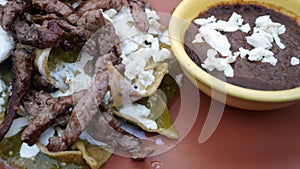 Mexican chilaquiles with meat and beans