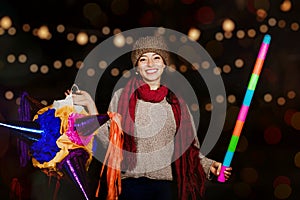 Mexican Christmas, Latin Girl Holding a colorful PiÃÂ±ata and celebrating a traditional Posada in Mexico City photo