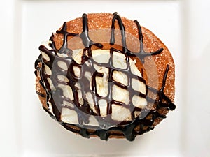 Mexican Churro Donut With Cream and Chocolate Toppings