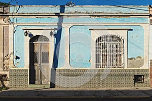 Mexican colonial house facade shined by sun, Merida, Yucatan, Mexico