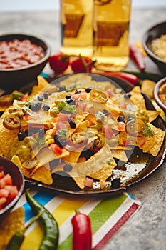 Mexican corn nacho spicy chips served with melted cheese