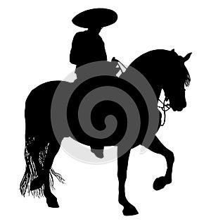 Mexican Cowboy riding a charro horse photo