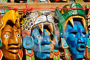 Mexican crafts for tourists on the market. Colorful Souvenirs, masks of Mayan warriors. Mexico