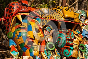 Mexican crafts for tourists on the market. Colorful Souvenirs, masks of Mayan warriors. Mexico