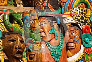 Mexican crafts for tourists on the market. Colorful Souvenirs, masks of Mayan warriors. Mexico