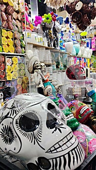 Ciudad de Mexico, Mexico - Oct 9 2022: Mexican crafts traditional hand painted skulls for the Day of the Dead altar tradition in M