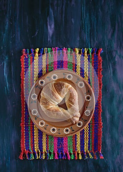 Mexican Cuernito Bread, Sugar Croissant on Woven Tablecloth.
