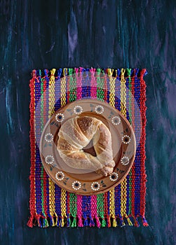 Mexican Cuernito Bread, Sugar Croissant on Woven Tablecloth. photo
