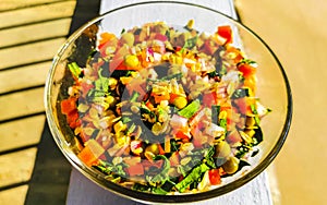 Mexican cuisine guacamole salad with tomatoes cucumbers avocado onions garlic