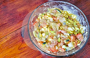 Mexican cuisine guacamole salad with tomatoes cucumbers avocado onions garlic