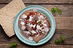 Mexican enfrijoladas with chorizo and fresh cheese