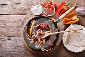 Mexican fajitas on a table. horizontal top view