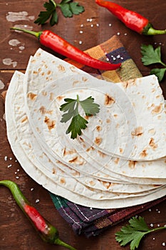 Mexican flatbread tortilla on wooden board